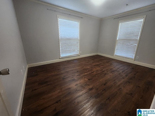 2030 Carraway St, Birmingham, AL 35235 - unfurnished room with dark wood finished floors and crown molding