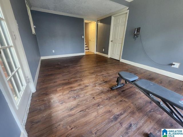 2030 Carraway St, Birmingham, AL 35235 - workout area with wood finished floors, crown molding, and a textured ceiling