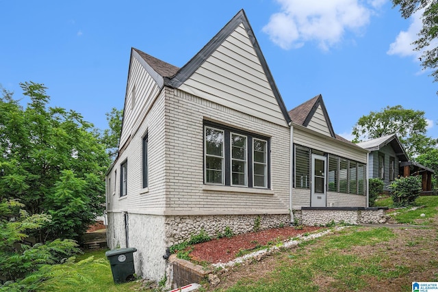2204 14th Ave N, Birmingham, AL 35234 - view of home's exterior featuring a sunroom