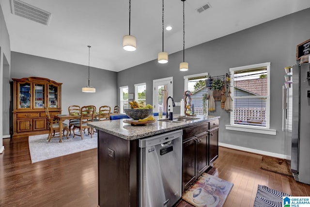 2165 Overlook Pl, Trussville, AL 35173 - kitchen with dishwasher, dark wood-type flooring, light stone countertops, an island with sink, and decorative light fixtures