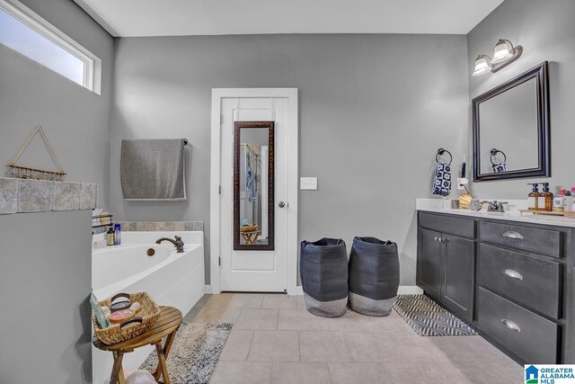 2165 Overlook Pl, Trussville, AL 35173 - bathroom featuring vanity, a garden tub, and tile patterned flooring