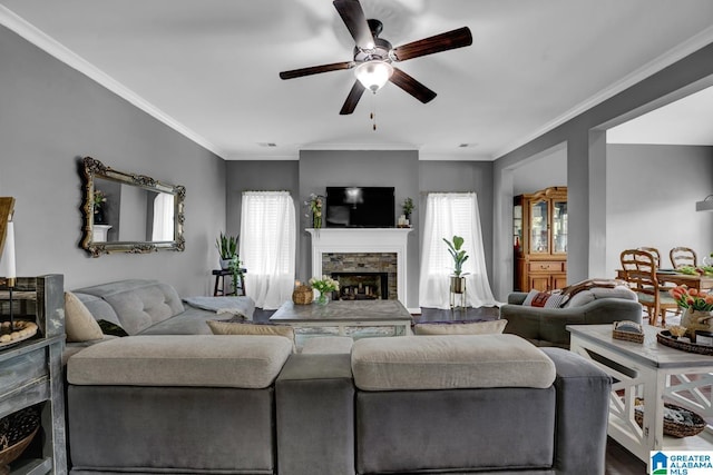 2165 Overlook Pl, Trussville, AL 35173 - living room with a ceiling fan, a stone fireplace, plenty of natural light, and ornamental molding