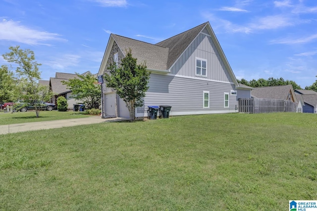 2165 Overlook Pl, Trussville, AL 35173 - view of property exterior with board and batten siding, driveway, a garage, and a shingled roof