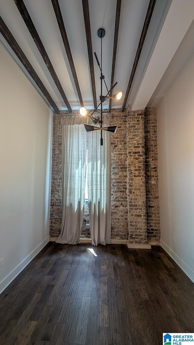 1801 2nd Ave N Unit 406, Birmingham, AL 35203 - unfurnished dining area with beam ceiling, wood finished floors, and a chandelier