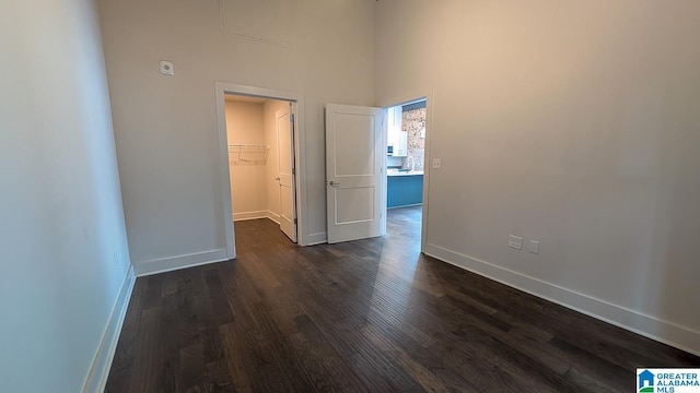 1801 2nd Ave N Unit 406, Birmingham, AL 35203 - spare room featuring dark wood-type flooring and a high ceiling