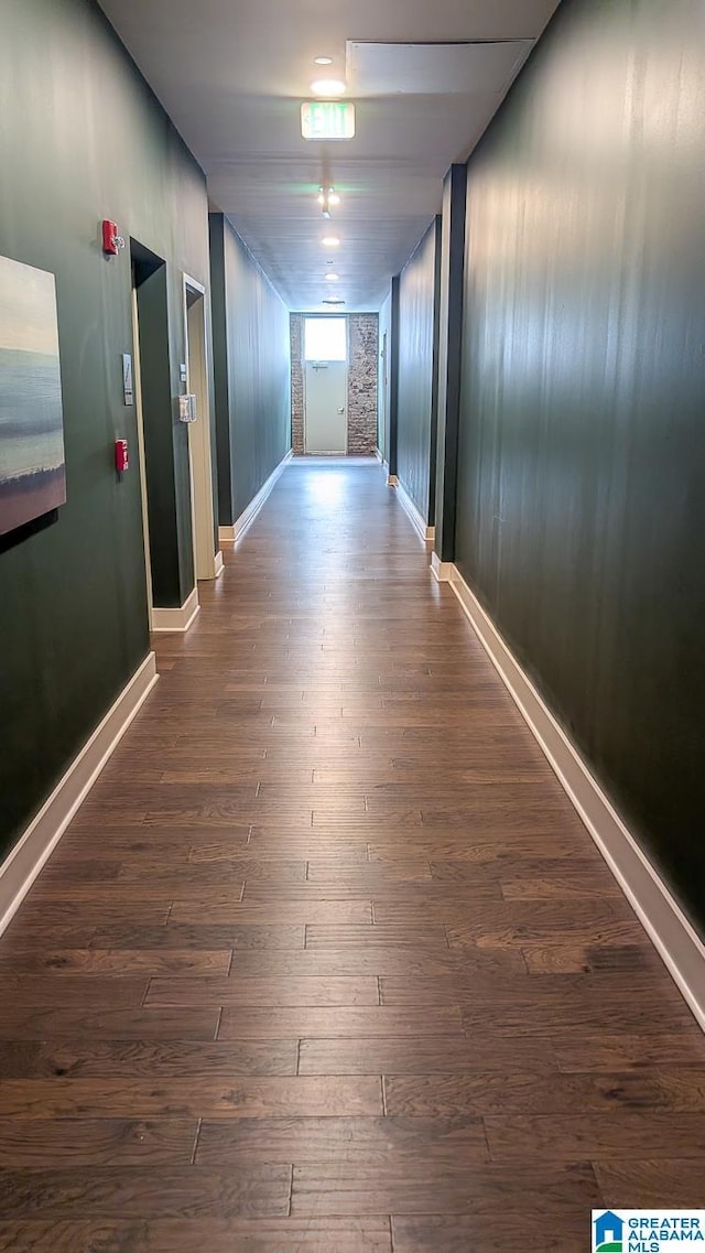 1801 2nd Ave N Unit 406, Birmingham, AL 35203 - hallway featuring dark wood-style floors and baseboards