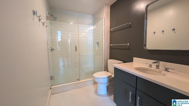 1801 2nd Ave N Unit 406, Birmingham, AL 35203 - full bath with a stall shower, vanity, and tile patterned floors