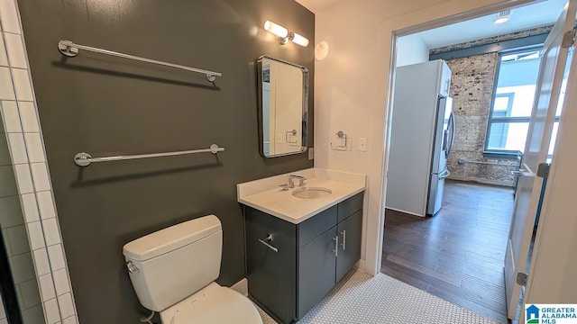 1801 2nd Ave N Unit 406, Birmingham, AL 35203 - bathroom featuring vanity and wood finished floors