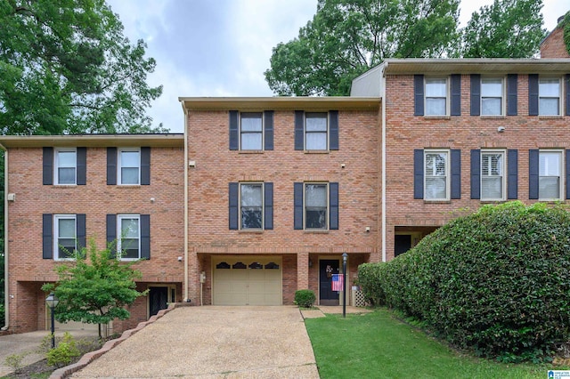 2418 Richelieu Ln, Hoover, AL 35216 - view of front of house featuring driveway, an attached garage, and brick siding