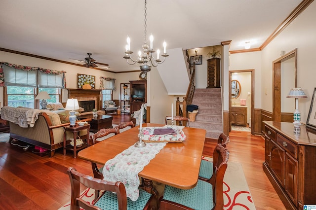 2418 Richelieu Ln, Hoover, AL 35216 - dining space with ceiling fan, stairs, light wood-style floors, ornamental molding, and wainscoting