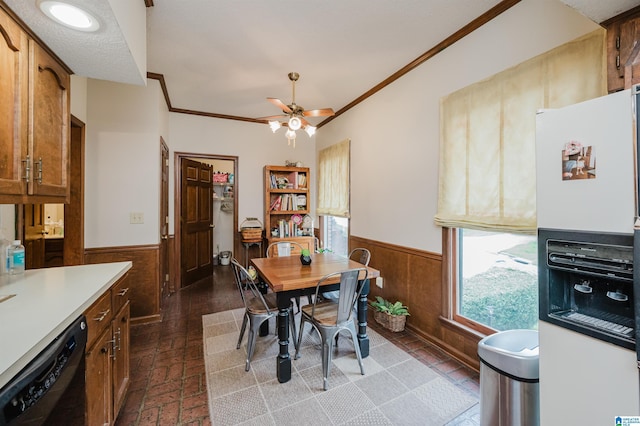 2418 Richelieu Ln, Hoover, AL 35216 - dining room featuring a wainscoted wall, wooden walls, ornamental molding, and a ceiling fan