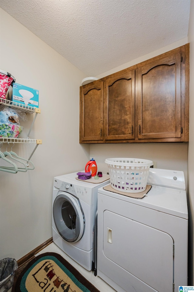 2418 Richelieu Ln, Hoover, AL 35216 - washroom with cabinet space, separate washer and dryer, and a textured ceiling