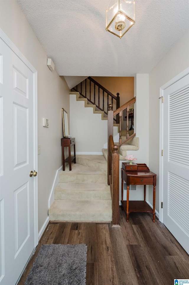 2418 Richelieu Ln, Hoover, AL 35216 - foyer featuring stairs, wood finished floors, and a textured ceiling