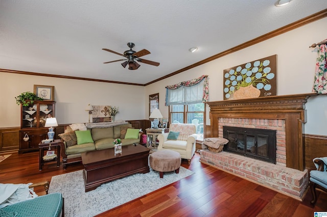 2418 Richelieu Ln, Hoover, AL 35216 - living room with a ceiling fan, ornamental molding, a fireplace, wood finished floors, and wainscoting