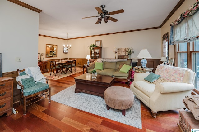 2418 Richelieu Ln, Hoover, AL 35216 - living room featuring a ceiling fan, wainscoting, crown molding, wood finished floors, and a chandelier