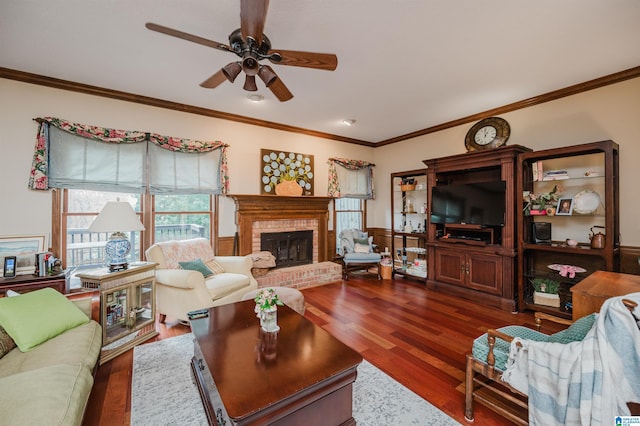 2418 Richelieu Ln, Hoover, AL 35216 - living area featuring a ceiling fan, wood finished floors, crown molding, and a brick fireplace