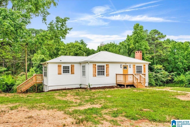 1818 Hillcrest Rd NE, Center Point, AL 35215 - back of house with a chimney, a yard, a metal roof, a deck, and stairway