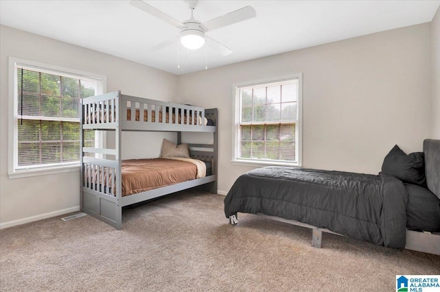 1818 Hillcrest Rd NE, Center Point, AL 35215 - carpeted bedroom with multiple windows and a ceiling fan