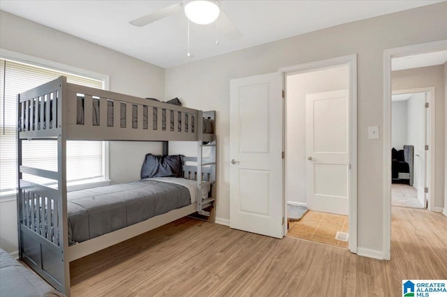 1818 Hillcrest Rd NE, Center Point, AL 35215 - bedroom featuring light wood-style floors, multiple windows, and a ceiling fan