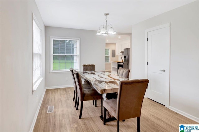 1818 Hillcrest Rd NE, Center Point, AL 35215 - dining room featuring light wood-style floors and a chandelier