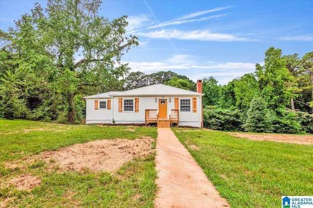 1818 Hillcrest Rd NE, Center Point, AL 35215 - view of front facade with a front yard and a chimney