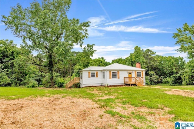 1818 Hillcrest Rd NE, Center Point, AL 35215 - view of front of property featuring a chimney, stairs, a wooden deck, and a front yard