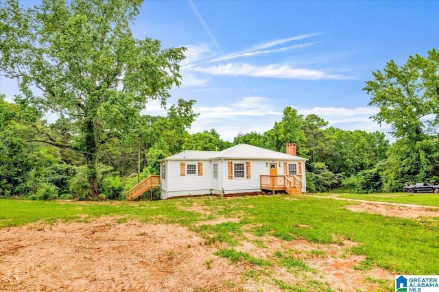 1818 Hillcrest Rd NE, Center Point, AL 35215 - view of front of home with a chimney, stairs, a deck, and a front lawn