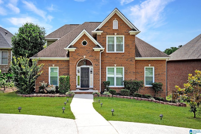 832 Meadow Ridge Ln, Birmingham, AL 35242 - view of front of property with brick siding, a front yard, and roof with shingles