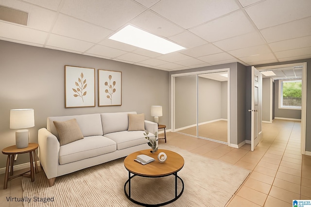 832 Meadow Ridge Ln, Birmingham, AL 35242 - living room featuring a paneled ceiling and light tile patterned flooring
