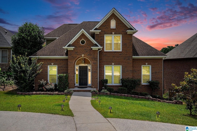 832 Meadow Ridge Ln, Birmingham, AL 35242 - view of front of house with brick siding, a lawn, and a shingled roof