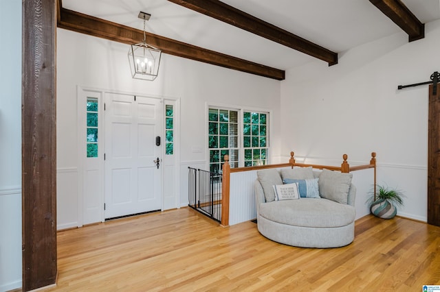 3204 Woodford Way, Birmingham, AL 35242 - foyer featuring a barn door, wood finished floors, beamed ceiling, and a chandelier