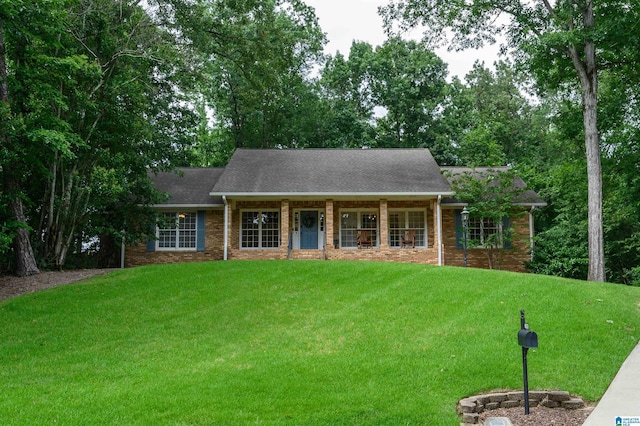 3204 Woodford Way, Birmingham, AL 35242 - view of front facade with a front yard, brick siding, covered porch, and roof with shingles