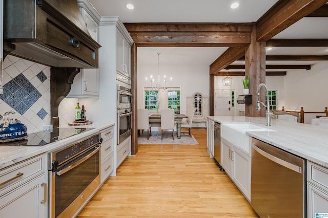 3204 Woodford Way, Birmingham, AL 35242 - kitchen featuring appliances with stainless steel finishes, custom range hood, light wood-type flooring, a chandelier, and beam ceiling