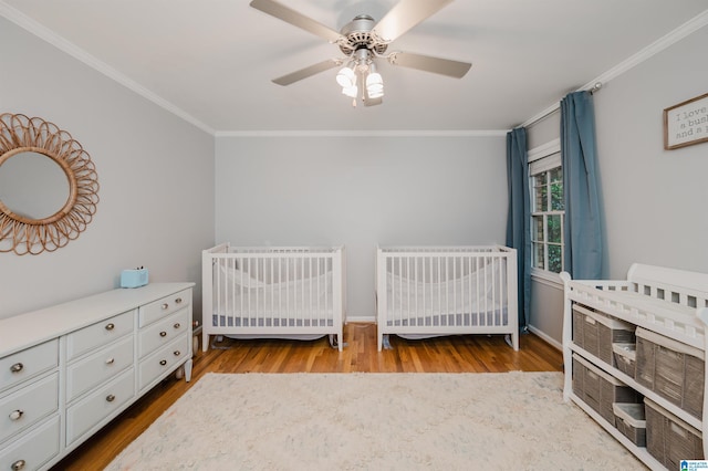3204 Woodford Way, Birmingham, AL 35242 - bedroom with heating unit, crown molding, wood finished floors, ceiling fan, and a crib
