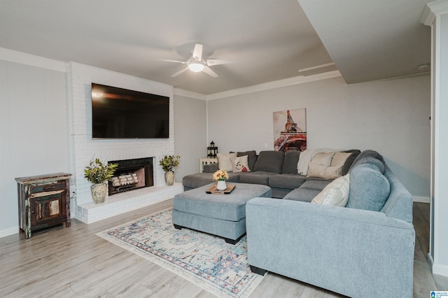 3204 Woodford Way, Birmingham, AL 35242 - living area featuring ceiling fan, wood finished floors, a brick fireplace, and crown molding