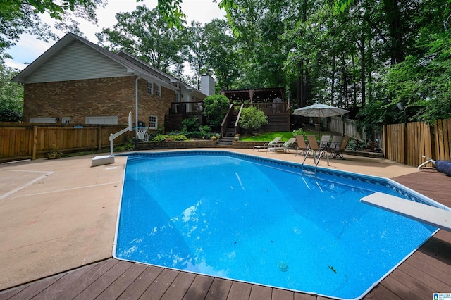 3204 Woodford Way, Birmingham, AL 35242 - view of pool featuring stairway, a wooden deck, a fenced backyard, and a diving board