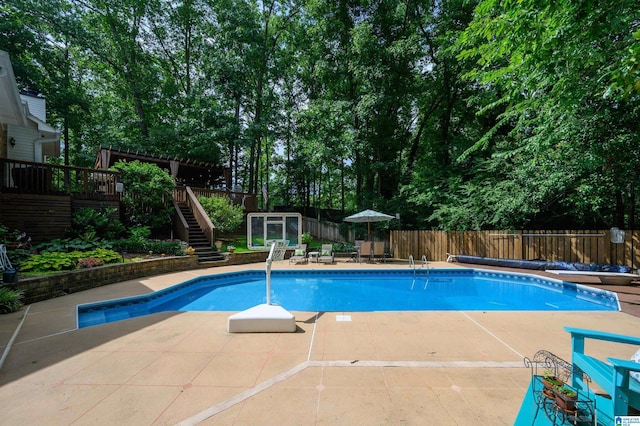 3204 Woodford Way, Birmingham, AL 35242 - view of pool with stairs, a wooden deck, a fenced backyard, a patio, and a diving board