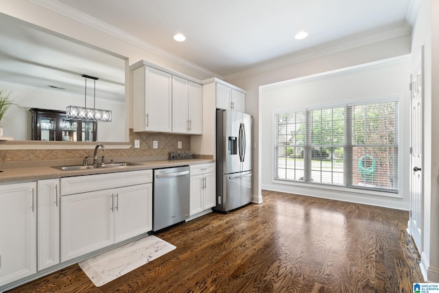 5912 Waterscape Pass, Hoover, AL 35244 - kitchen featuring appliances with stainless steel finishes, decorative backsplash, dark wood-style floors, white cabinetry, and ornamental molding