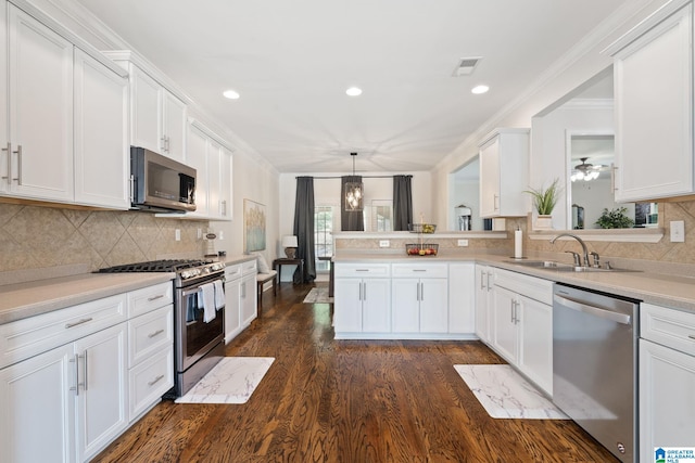 5912 Waterscape Pass, Hoover, AL 35244 - kitchen featuring appliances with stainless steel finishes, dark wood-style floors, white cabinets, tasteful backsplash, and recessed lighting