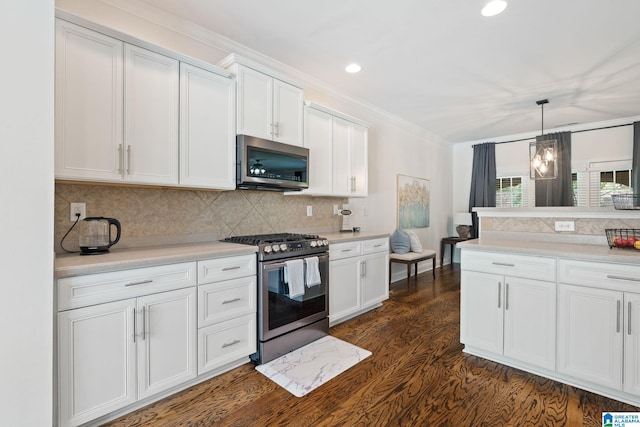 5912 Waterscape Pass, Hoover, AL 35244 - kitchen with appliances with stainless steel finishes, dark wood finished floors, white cabinetry, light countertops, and crown molding