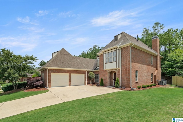 5912 Waterscape Pass, Hoover, AL 35244 - view of front of house featuring a chimney, brick siding, an attached garage, driveway, and roof with shingles