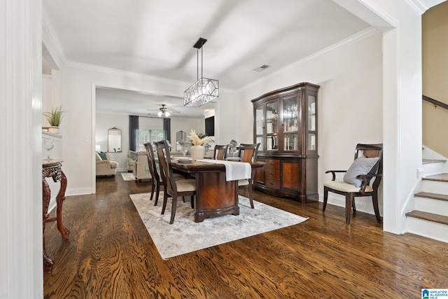 5912 Waterscape Pass, Hoover, AL 35244 - dining area with stairway, dark wood finished floors, ornamental molding, and ceiling fan