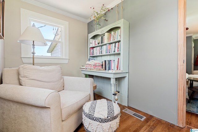 104 Phillips Cir, Columbiana, AL 35051 - living area featuring crown molding and wood finished floors