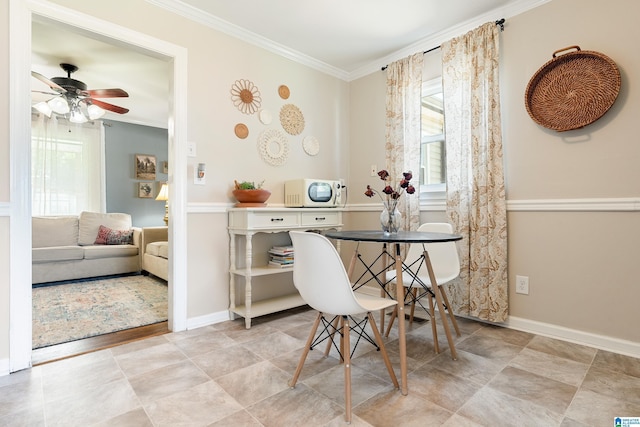 104 Phillips Cir, Columbiana, AL 35051 - dining area with plenty of natural light, crown molding, and a ceiling fan