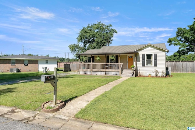 104 Phillips Cir, Columbiana, AL 35051 - ranch-style house with covered porch and a metal roof