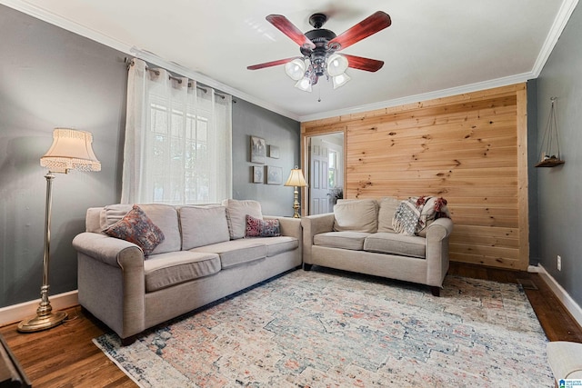 104 Phillips Cir, Columbiana, AL 35051 - living room featuring wood finished floors, a ceiling fan, ornamental molding, and healthy amount of natural light