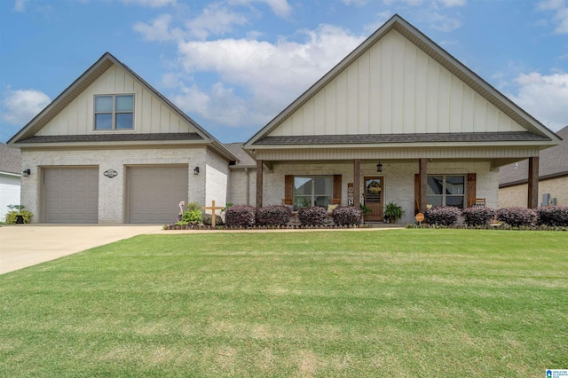 11967 Glen Ridge Blvd, Moundville, AL 35474 - view of front of property with board and batten siding, brick siding, a front lawn, concrete driveway, and an attached garage