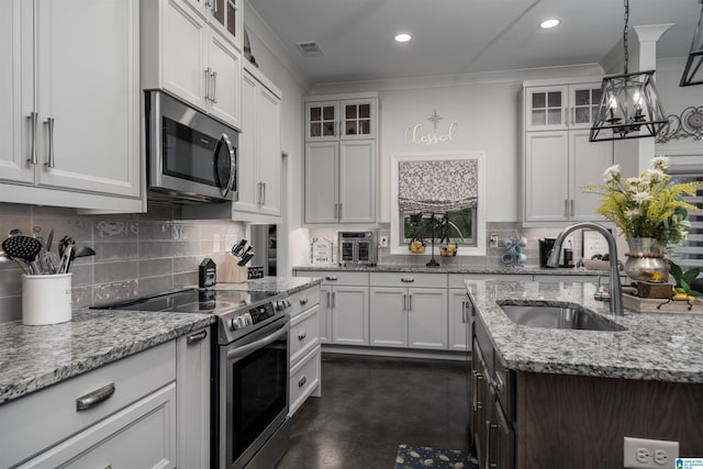 11967 Glen Ridge Blvd, Moundville, AL 35474 - kitchen featuring stainless steel appliances, finished concrete floors, tasteful backsplash, ornamental molding, and light stone countertops