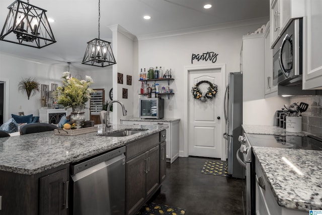 11967 Glen Ridge Blvd, Moundville, AL 35474 - kitchen with appliances with stainless steel finishes, finished concrete floors, tasteful backsplash, a chandelier, and an island with sink