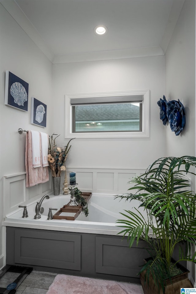11967 Glen Ridge Blvd, Moundville, AL 35474 - bathroom featuring a bath, ornamental molding, plenty of natural light, and wood finished floors
